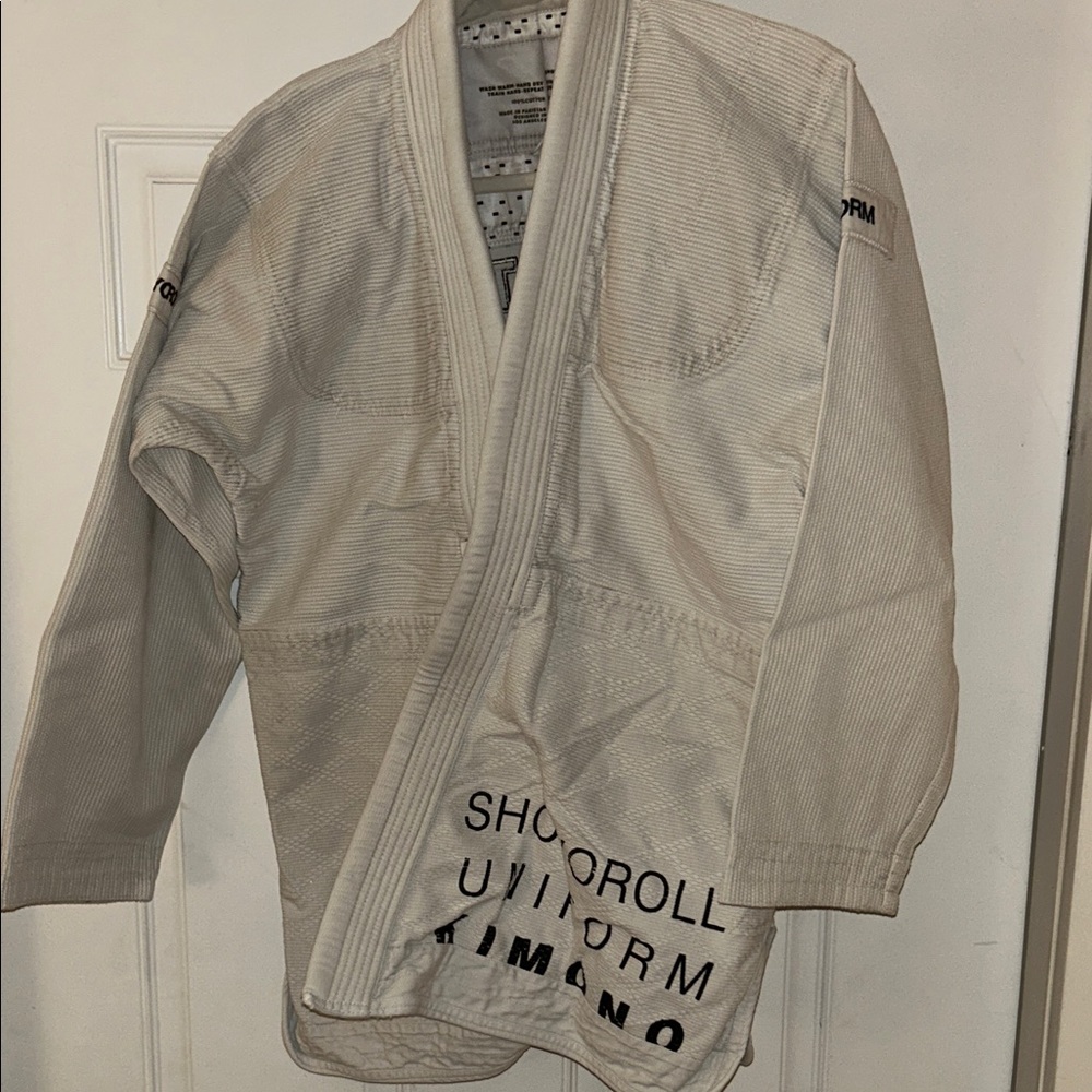 White Jacket with Black Statement Text
